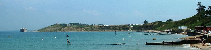 Colwell Bay overlooking the Solent and Hurst Castle on the Isle of Wight, Brambles Chine Self Catering bungalows can be seen just above the beach.